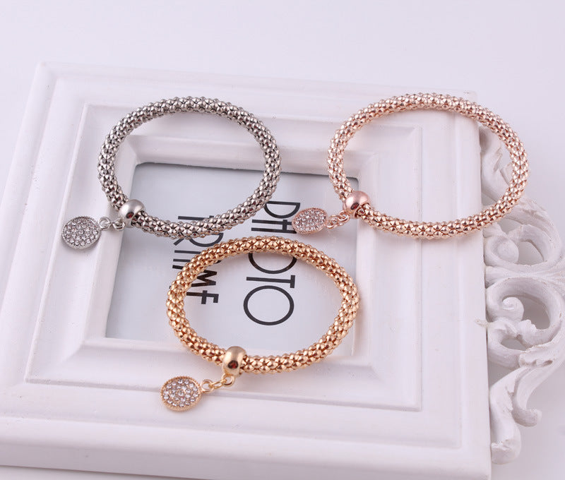 Jeweled Metal Disc Charm Bracelets